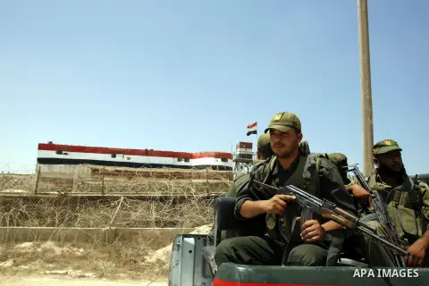Palestinian security forces stand guard on the border between Egypt and the southern Gaza Strip, near Rafah August 6, 2012. Egypt has closed the terminal, the only gateway for Gaza's people after the deadly attack on its...