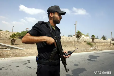 A Palestinian security officer stand guard on the border between Egypt and the southern Gaza Strip, near Rafah August 6, 2012. Egypt has closed the terminal, the only gateway for Gaza's people after the deadly attack on...