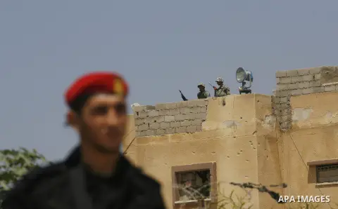 A Palestinian security officer (front) and Egyptian soldiers (rear) stand guard on the border between Egypt and the southern Gaza Strip, near Rafah August 6, 2012. Egypt has closed the terminal, the only gateway for Gaza...