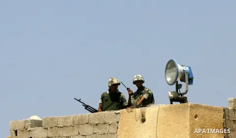 Egyptian soldiers stand guard on the border between Egypt and the southern Gaza Strip, near Rafah August 6, 2012. Egypt has closed the terminal, the only gateway for Gaza's people after the deadly attack on its soldiers...