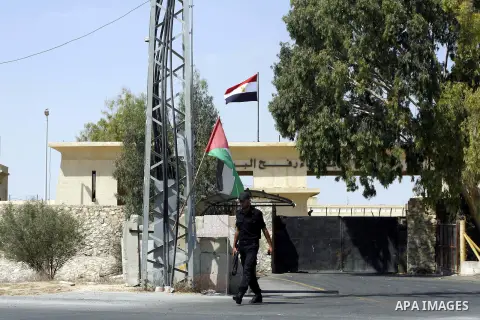 A Palestinian police officer walks on the Palestinian side of Rafah border crossing between southern Gaza Strip and Egypt, Monday, Aug. 6, 2012. Egypt has closed the terminal, the only gateway for Gaza's people after the...