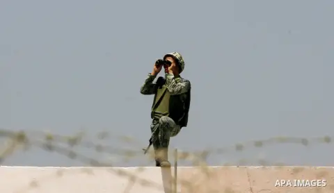 Egyptian soldiers stand guard on the border between Egypt and the southern Gaza Strip, near Rafah August 6, 2012. Egypt has closed the terminal, the only gateway for Gaza's people after the deadly attack on its soldiers...