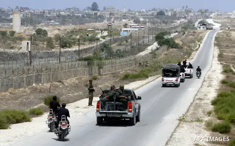 Palestinian security forces stand guard on the border between Egypt and the southern Gaza Strip, near Rafah August 6, 2012. Egypt has closed the terminal, the only gateway for Gaza's people after the deadly attack on its...