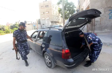 Palestinians Hamas security guard during searching cars near the border between Egypt and Gaza strip in Rafah town southern Gaza strip on, 06 August 2012. Reports state that at least five gunmen were killed after they tr...