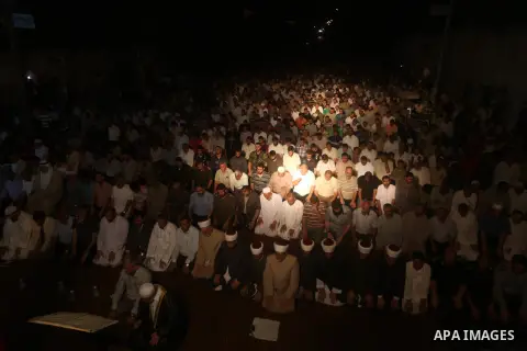 Palestinian Prime Minister in Gaza Ismail Haniyeh leads a night prayer known as "Tarawih" at a sit-in tent in Gaza city, solidarity with Egyptian soldiers who were killed on Rafah border between Egypt and the southern Ga...