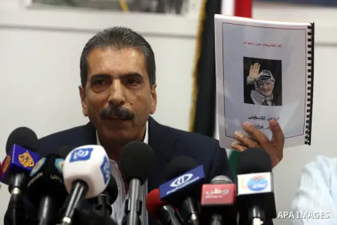 Palestinian Tawfik Terawi, speaks during a press conference in the West Bank city of Ramallah, Wednesday, Aug. 8, 2012. Tirawi said Wednesday Palestinian officials have invited Swiss experts to test the leader's Arafat f...