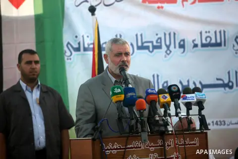 Palestinian Prime Minister in Gaza Strip, Ismail Haniyeh, breaks his fast with a Palestinian released Prisoners during the holy month of Ramadan, in Gaza city on 09 August 2012. Photo by Majdi Fathi