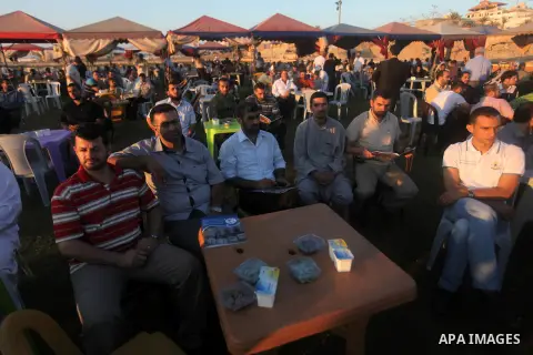 Palestinian Prime Minister in Gaza Strip, Ismail Haniyeh, breaks his fast with a Palestinian released Prisoners during the holy month of Ramadan, in Gaza city on 09 August 2012. Photo by Majdi Fathi