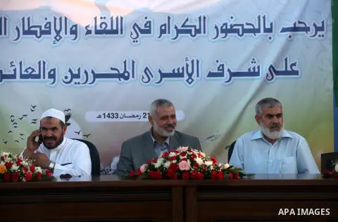 Palestinian Prime Minister in Gaza Strip, Ismail Haniyeh, breaks his fast with a Palestinian released Prisoners during the holy month of Ramadan, in Gaza city on 09 August 2012. Photo by Majdi Fathi