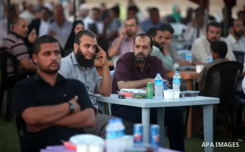 Palestinian Prime Minister in Gaza Strip, Ismail Haniyeh, breaks his fast with a Palestinian released Prisoners during the holy month of Ramadan, in Gaza city on 09 August 2012. Photo by Majdi Fathi