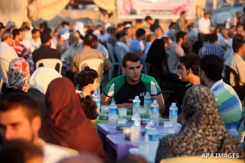Palestinian Prime Minister in Gaza Strip, Ismail Haniyeh, breaks his fast with a Palestinian released Prisoners during the holy month of Ramadan, in Gaza city on 09 August 2012. Photo by Majdi Fathi