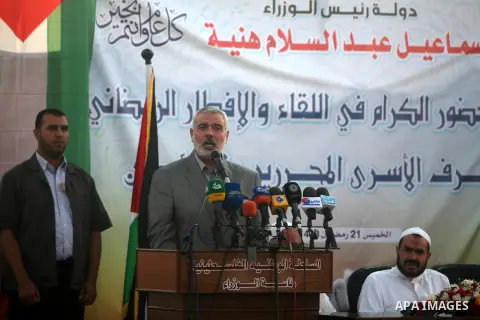 Palestinian Prime Minister in Gaza Strip, Ismail Haniyeh, breaks his fast with a Palestinian released Prisoners during the holy month of Ramadan, in Gaza city on 09 August 2012. Photo by Majdi Fathi