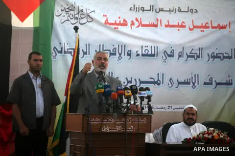 Palestinian Prime Minister in Gaza Strip, Ismail Haniyeh, breaks his fast with a Palestinian released Prisoners during the holy month of Ramadan, in Gaza city on 09 August 2012. Photo by Majdi Fathi