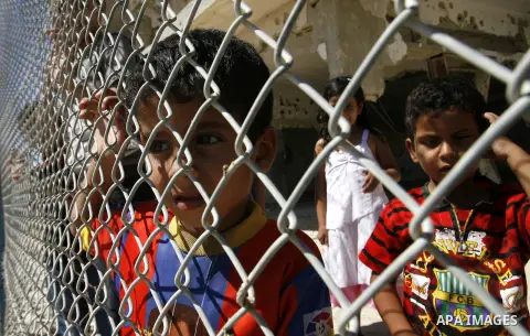 Palestinian children wait passengers arrive from Egypt at the Rafah border crossing in the southern Gaza Strip August 10, 2012. Egyptian military forces have captured six "terrorists" in the Sinai region after an attack...