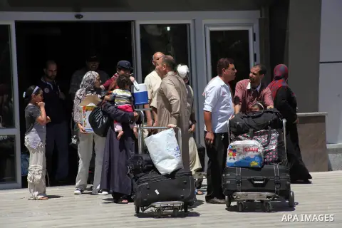 Palestinians return from Egypt cross into the southern Gaza Strip at the Rafah border crossing August 10, 2012. Egyptian military forces have captured six "terrorists" in the Sinai region after an attack on a police stat...