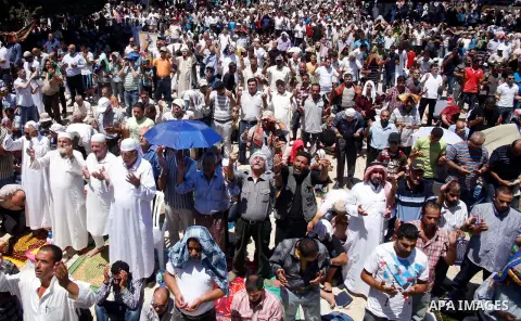 Muslim men pray outside the Dome of the Rock mosque situated in the al-Aqsa mosque compound, Islam's third most holy site, on August 10, 2011 in old city of Jerusalem, on a Friday during the Muslim holy fasting month of...