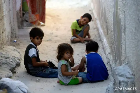 Palestinian children play in front of their house in Rafah refugee camp southern Gaza Strip, on 11 August 2012. Photo by Eyad Al Baba