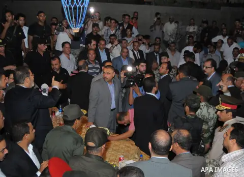 Newly elected Egyptian President Mohamed Mursi is flanked by Field Marshal Hussein Tantawi and Egyptian Armed Forces Chief of Staff Sami Anan as he talks to the soldiers at a checkpoint in al-Arish August 10, 2012. Egypt...