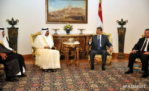 Egypt's President Mohamed Mursi, meets with Qatar's Emir Sheikh Hamad bin Khalifa al-Thani at the presidential palace in Cairo, August 11, 2012. Qatar said on Saturday it would deposit $2 billion at the Egyptian Central...