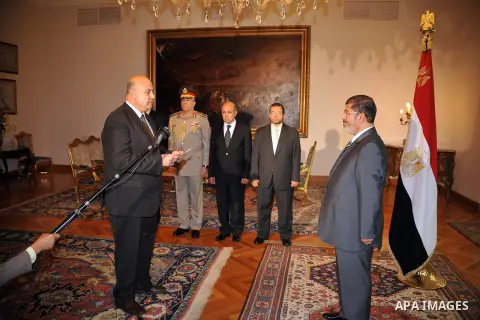 Newly nominated Vice President Mahmoud Mekki taking the oath before Egyptian President Mohamed Morsi, at the Presidential palace, in Cairo, Egypt, 12 August 2012. Egyptian President Mohammed Morsi on 12 August ordered th...