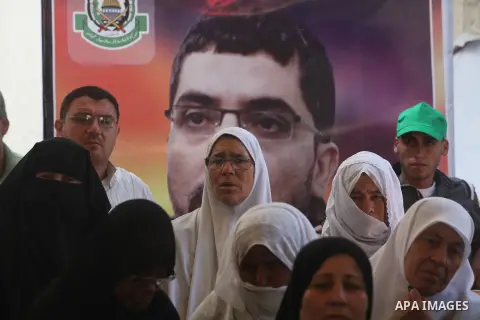Palestinian women hold pictures of their relatives prisoners in Israeli jails as they gather in an activity calling for their liberty at the Red Cross headquarters in Gaza City on 13 August 2012. Photo by Majdi Fathi
