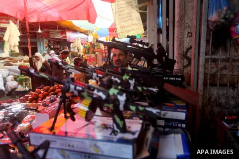 A Palestinian vendor displays his goods at a market in Gaza city on Aug 13,2012, as Muslims over the world prepare to celebrate Eid al-Fitr, a three day holiday marking the end of the religious month of Ramadan in which...