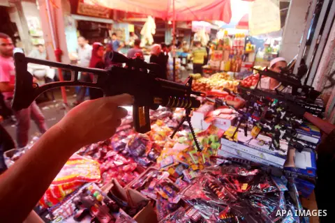 A Palestinian vendor displays his goods at a market in Gaza city on Aug 13,2012, as Muslims over the world prepare to celebrate Eid al-Fitr, a three day holiday marking the end of the religious month of Ramadan in which...