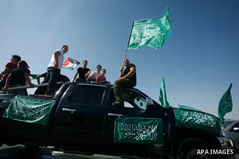 Palestinians celebrate after the Israeli authorities released prisoner Aws Ibrahim Hamada in neighborhood of Sour Baher in Jerusalem on Aug 13, 2012. Hamada spent 10 years in prison before the Israeli authorities release...