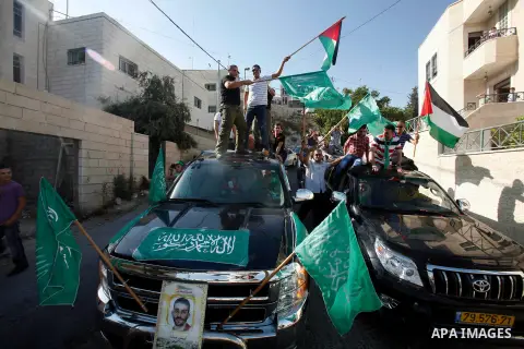 Palestinians celebrate after the Israeli authorities released prisoner Aws Ibrahim Hamada in neighborhood of Sour Baher in Jerusalem on Aug 13, 2012. Hamada spent 10 years in prison before the Israeli authorities release...