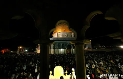 Palestinian Muslim worshippers pray during Laylat Al Qadr, also known as the Night of Power, in front of the Dome of the Rock Mosque, in the Al Aqsa Mosque compound in Jerusalem's Old City, Tuesday Aug 14,2012. Laylat Al...