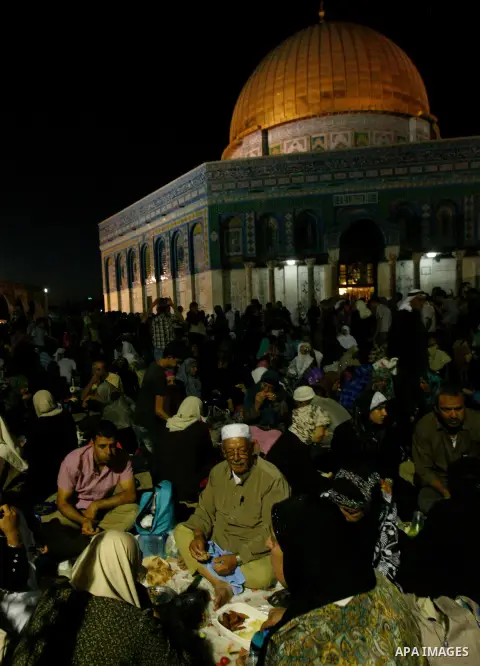Palestinian Muslim worshippers pray during Laylat Al Qadr, also known as the Night of Power, in front of the Dome of the Rock Mosque, in the Al Aqsa Mosque compound in Jerusalem's Old City, Tuesday Aug 14,2012. Laylat Al...
