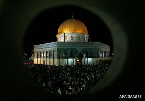 Palestinian Muslim worshippers pray during Laylat Al Qadr, also known as the Night of Power, in front of the Dome of the Rock Mosque, in the Al Aqsa Mosque compound in Jerusalem's Old City, Tuesday Aug 14,2012. Laylat Al...