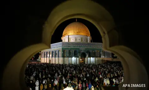 Palestinian Muslim worshippers pray during Laylat Al Qadr, also known as the Night of Power, in front of the Dome of the Rock Mosque, in the Al Aqsa Mosque compound in Jerusalem's Old City, Tuesday Aug 14,2012. Laylat Al...