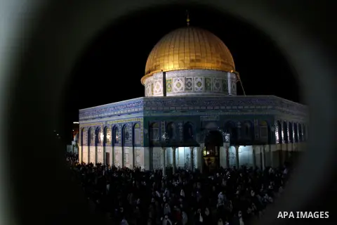 Palestinian Muslim worshippers pray during Laylat Al Qadr, also known as the Night of Power, in front of the Dome of the Rock Mosque, in the Al Aqsa Mosque compound in Jerusalem's Old City, Tuesday Aug 14,2012. Laylat Al...