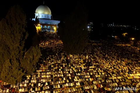 Palestinian Muslim worshippers pray during Laylat Al Qadr, also known as the Night of Power, in front of the Dome of the Rock Mosque, in the Al Aqsa Mosque compound in Jerusalem's Old City, Tuesday Aug 14,2012. Laylat Al...