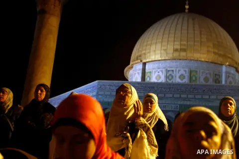 Palestinian Muslim worshippers pray during Laylat Al Qadr, also known as the Night of Power, in front of the Dome of the Rock Mosque, in the Al Aqsa Mosque compound in Jerusalem's Old City, Tuesday Aug 14,2012. Laylat Al...