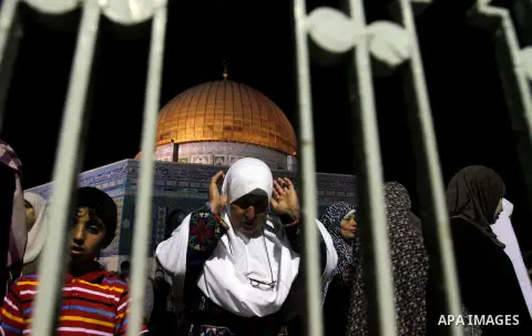 Palestinian Muslim worshippers pray during Laylat Al Qadr, also known as the Night of Power, in front of the Dome of the Rock Mosque, in the Al Aqsa Mosque compound in Jerusalem's Old City, Tuesday Aug 14,2012. Laylat Al...