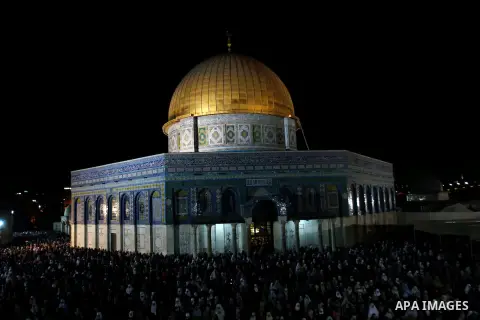 Palestinian Muslim worshippers pray during Laylat Al Qadr, also known as the Night of Power, in front of the Dome of the Rock Mosque, in the Al Aqsa Mosque compound in Jerusalem's Old City, Tuesday Aug 14,2012. Laylat Al...