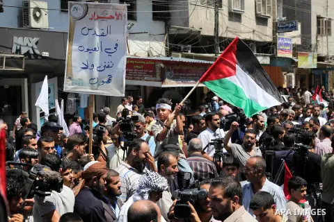 Palestinian demonstrators take part in an annual rally marking Al-Quds Day (Jerusalem Day) , on the last Friday of the holy month of Ramadan, in Gaza city, Friday, Aug. 17, 2012. Photo by Ashraf Amra
