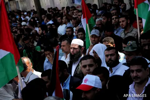 Palestinian demonstrators take part in an annual rally marking Al-Quds Day (Jerusalem Day) , on the last Friday of the holy month of Ramadan, in Gaza city, Friday, Aug. 17, 2012. Photo by Ashraf Amra