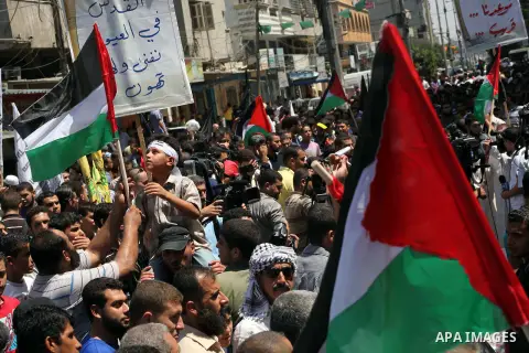 Palestinian demonstrators chant slogans during an annual rally marking Al-Quds Day (Jerusalem Day), on the last Friday of the holy month of Ramadan, in Gaza city, Friday, Aug. 17, 2012. Photo by Ashraf Amra