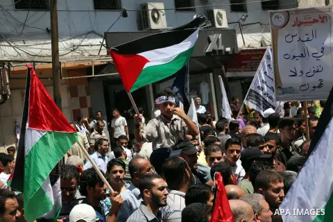 Palestinian demonstrators chant slogans during an annual rally marking Al-Quds Day (Jerusalem Day), on the last Friday of the holy month of Ramadan, in Gaza city, Friday, Aug. 17, 2012. Photo by Ashraf Amra