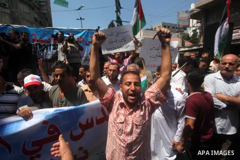 Palestinian demonstrators chant slogans during an annual rally marking Al-Quds Day (Jerusalem Day), on the last Friday of the holy month of Ramadan, in Gaza city, Friday, Aug. 17, 2012. Photo by Ashraf Amra