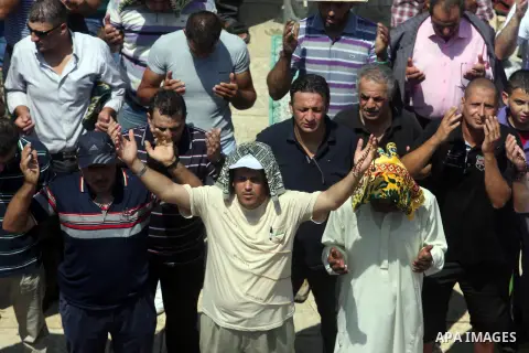Palestinian Muslim worshippers pray outside the Dome of the Rock at al-Aqsa mosque compound, Islam's third holiest site, on August 17, 2012, in the old city of Jerusalem, on the last Friday of the Muslim holy fasting mon...