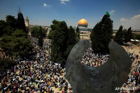Palestinian Muslim worshippers pray outside the Dome of the Rock at al-Aqsa mosque compound, Islam's third holiest site, on August 17, 2012, in the old city of Jerusalem, on the last Friday of the Muslim holy fasting mon...