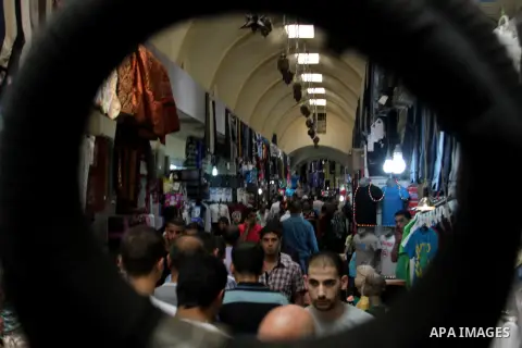 Palestinians shop at market during preparations for the Eid Al-Fitr feast in the West Bank city of Nablus on Aug 18, 2012, as Muslims over the world prepare to celebrate Eid al-Fitr, a three day holiday marking the end o...