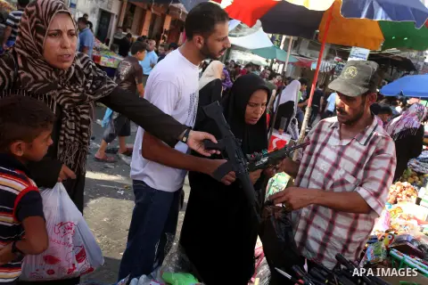 Palestinians buy toys at the main market during preparations for the Eid Al-Fitr feast Gaza city on Aug 18, 2012, as Muslims over the world prepare to celebrate Eid al-Fitr, a three day holiday marking the end of the rel...