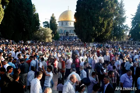 Palestinians attend the Eid al-Fitr prayers at al-Aqsa mosque in Jerusalem's Old City, Sunday, Aug. 19, 2012. Muslims are celebrating the festival of Eid al-Fitr which marks the end of the holy fasting month of Ramadan....