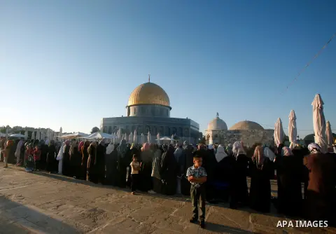 Palestinians attend the Eid al-Fitr prayers at al-Aqsa mosque in Jerusalem's Old City, Sunday, Aug. 19, 2012. Muslims are celebrating the festival of Eid al-Fitr which marks the end of the holy fasting month of Ramadan....