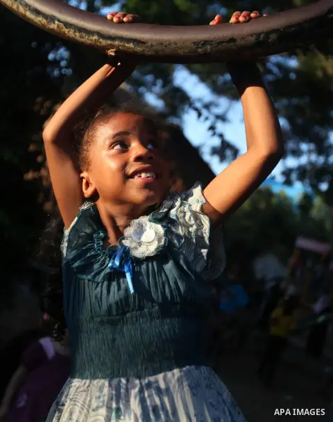 A Palestinian girl plays at a park during the Second day of Eid al-Fitr in Gaza city, Aug. 20, 2012. which marks the end of the Muslim fasting month of Ramadan. Eid, one of the most important holidays in the Muslim world...